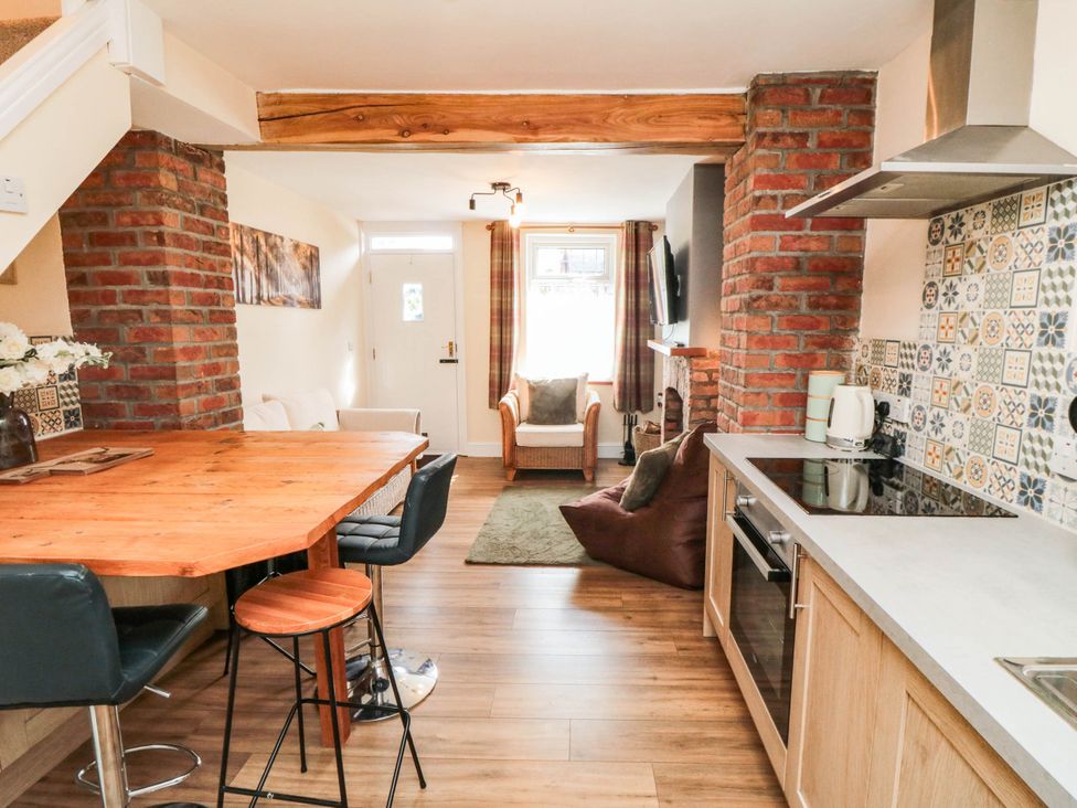 A kitchen with dining table and seating area at 45 St. Hildas Street in Sherburn