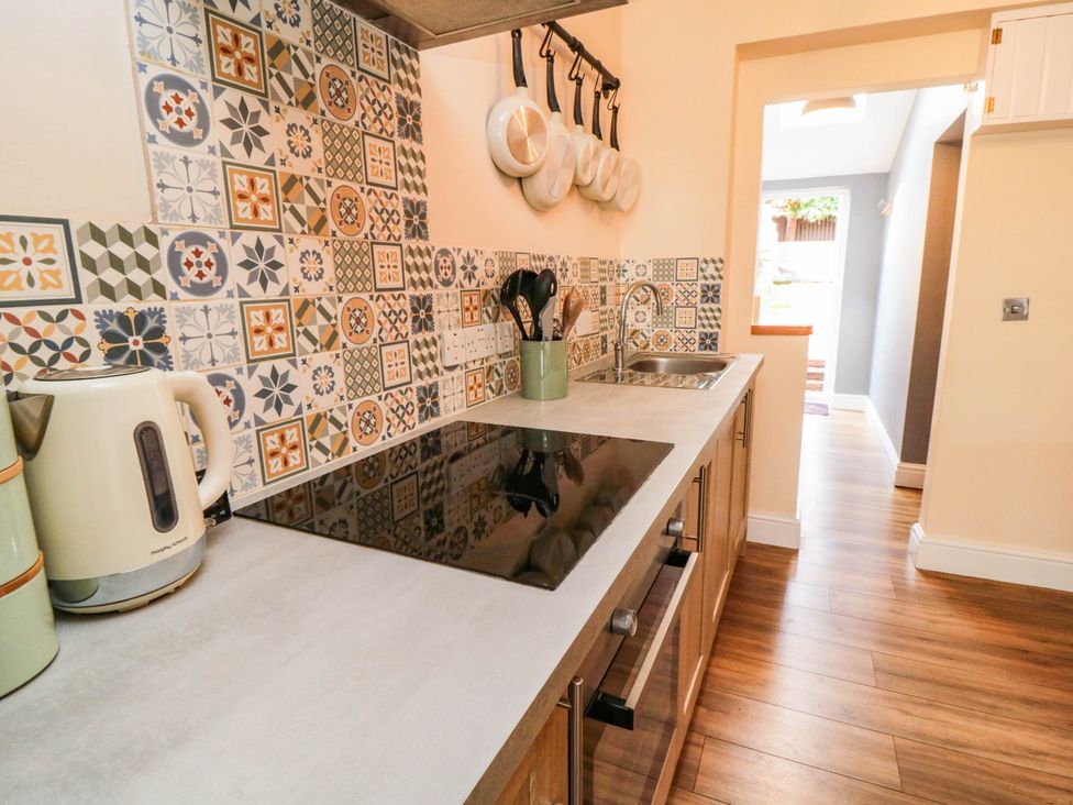 A kitchen with a countertop and utensils at 45 St. Hildas Street in Sherburn