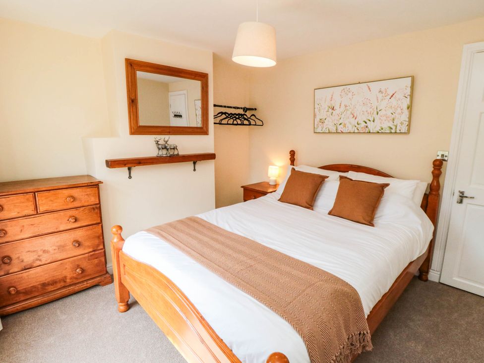 A bedroom with a bed and dresser at 45 St. Hildas Street in Sherburn