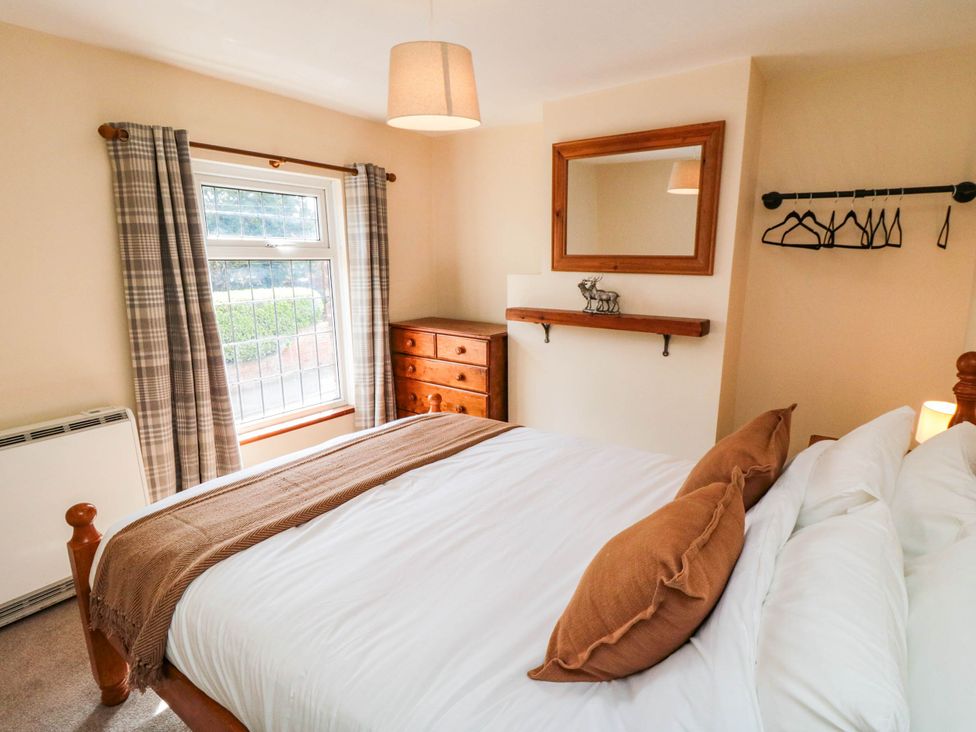 A bedroom with a bed and dresser at 45 St. Hildas Street in Sherburn