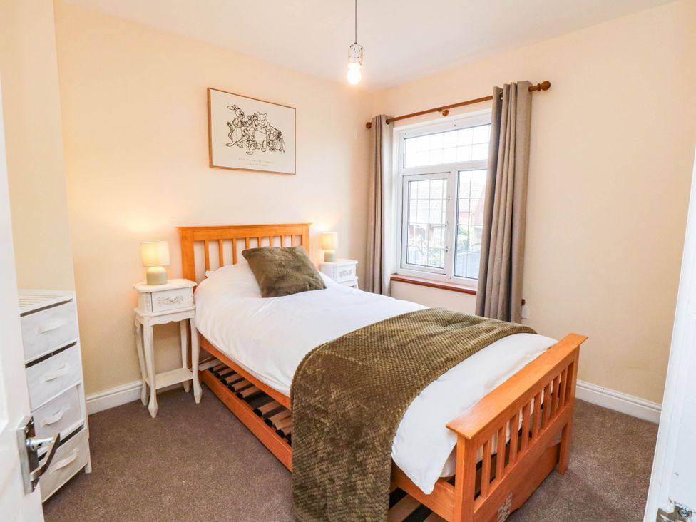 A bedroom with a bed and bedside tables at 45 St. Hildas Street in Sherburn