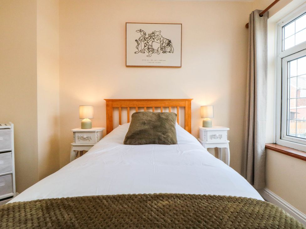 A bedroom with a bed and nightstands at 45 St. Hildas Street, Sherburn