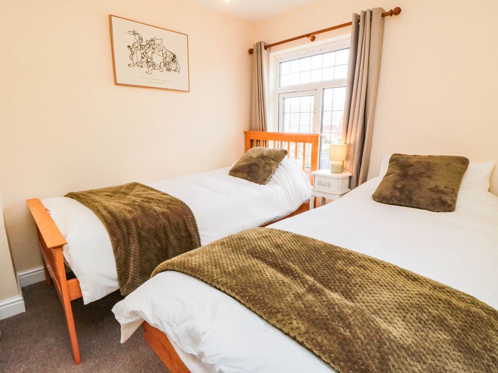 A bedroom with two single beds and a lamp at 45 St. Hildas Street in Sherburn