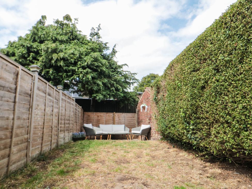 A garden with seating area at 45 St. Hildas Street in Sherburn
