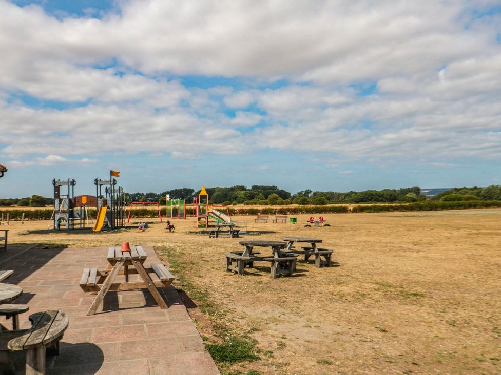 An outdoor area with a playground and picnic tables at 45 St. Hildas Street in Sherburn