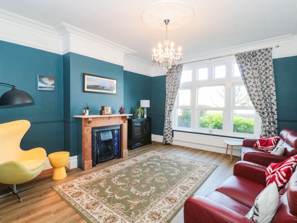 A living room with sofa and armchair at Ashbourne House