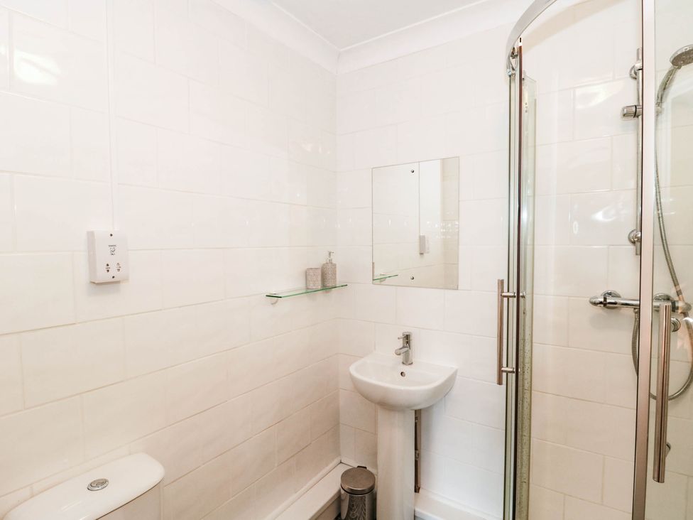 A bathroom with a shower and sink at Ashbourne House