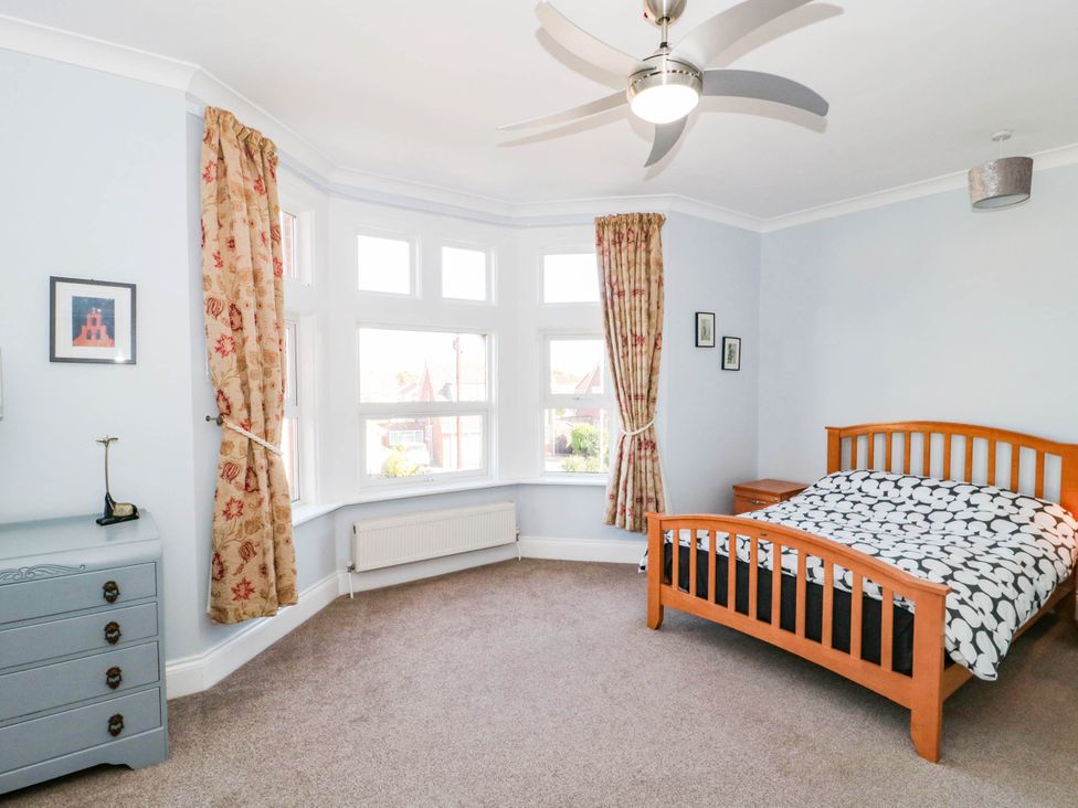 A bedroom with a bed and chest of drawers at Ashbourne House