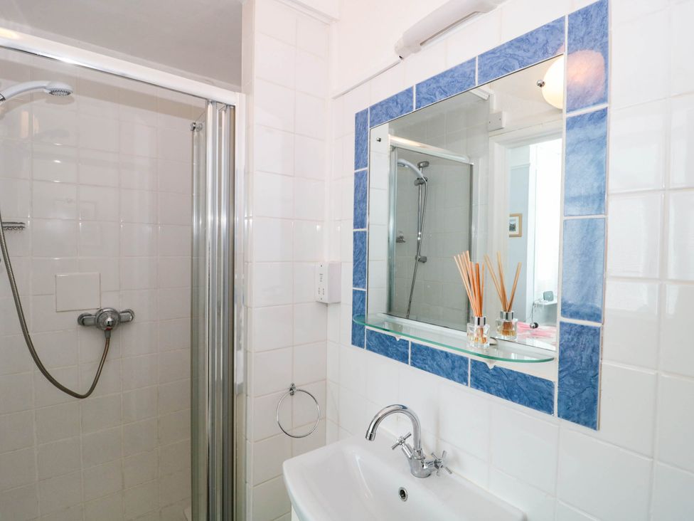 A bathroom with a shower and sink at Ashbourne House