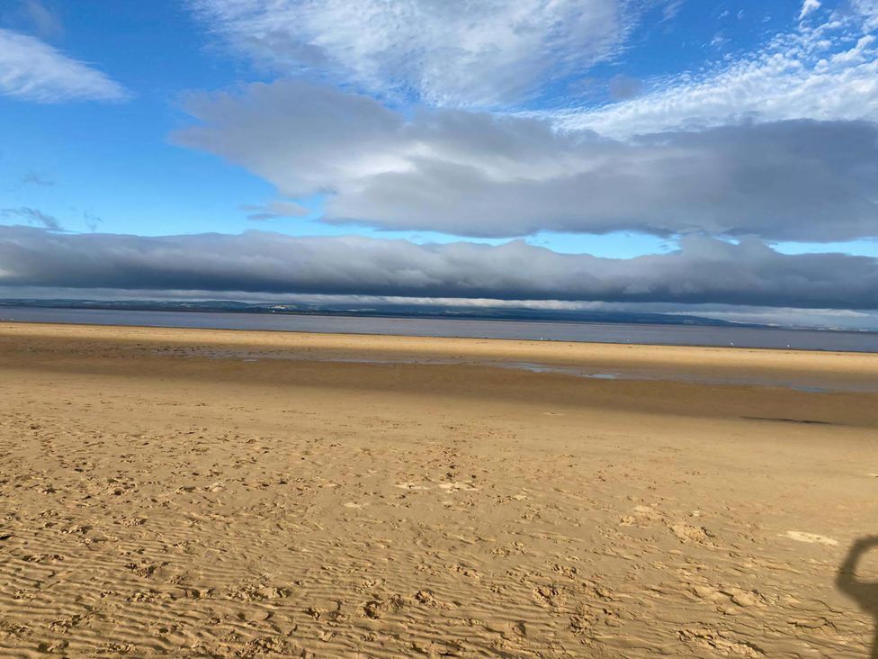 A beach area with sand and water at Ashbourne House in Burnham-On-Sea