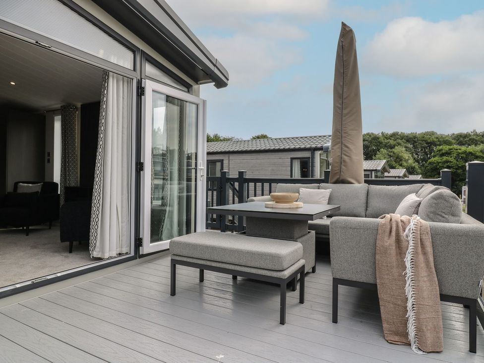A balcony with outdoor sofa and coffee table at Lakewood Plot 7 in Clacton-on-Sea