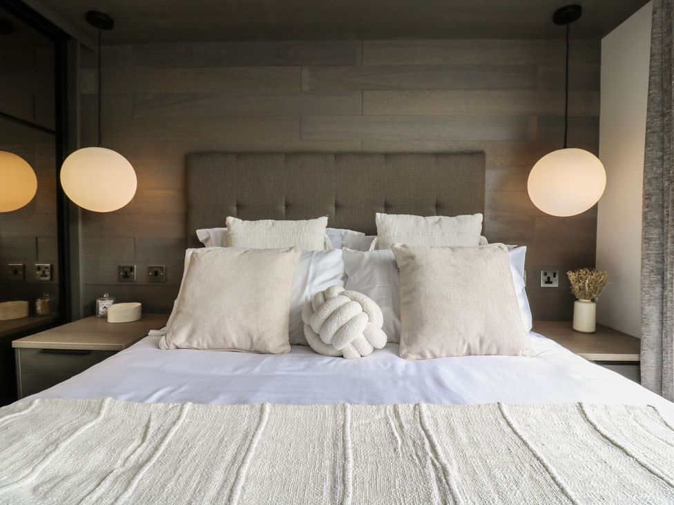 A bedroom with a bed and pillows at Lakewood Plot 7 Clacton-on-Sea