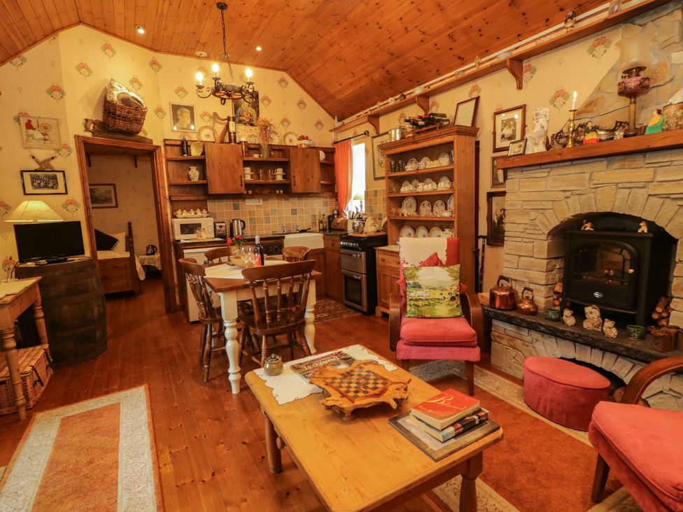 A kitchen with dining table and chairs at Teresa's Cottage