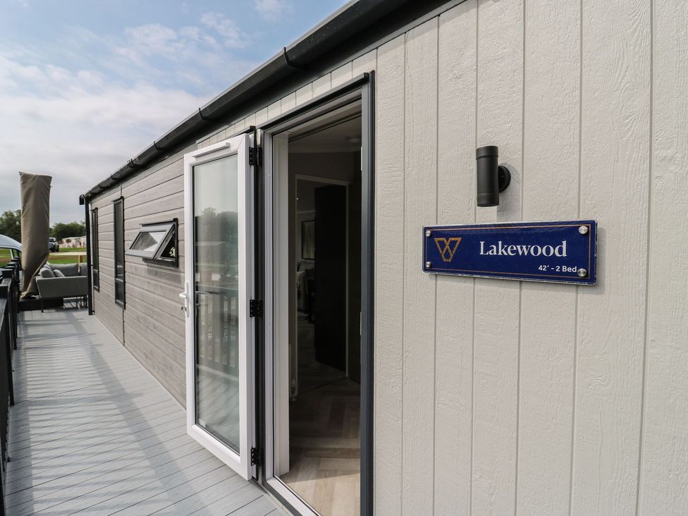 An entrance to the Lakewood with a deck at Lakewood Plot 8