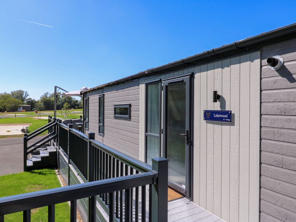 An outdoor view of a cabin entrance at Lakewood Plot 9 St. Osyth