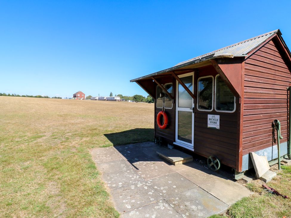 A bicycle store with a lifebuoy outside at Lakewood Plot 9 St. Osyth