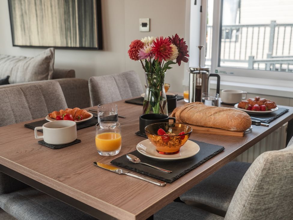 A dining table set with food and drinks at Lakewood Plot 9 St. Osyth