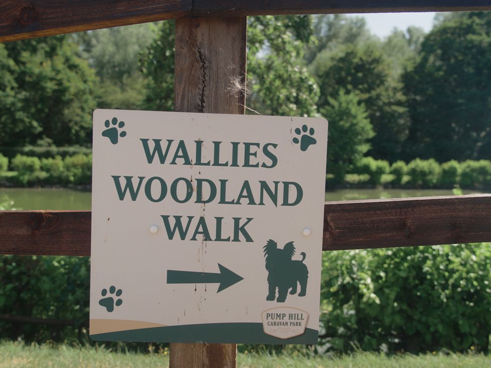 A sign for Wallies Woodland Walk at Pump Hill Caravan Park