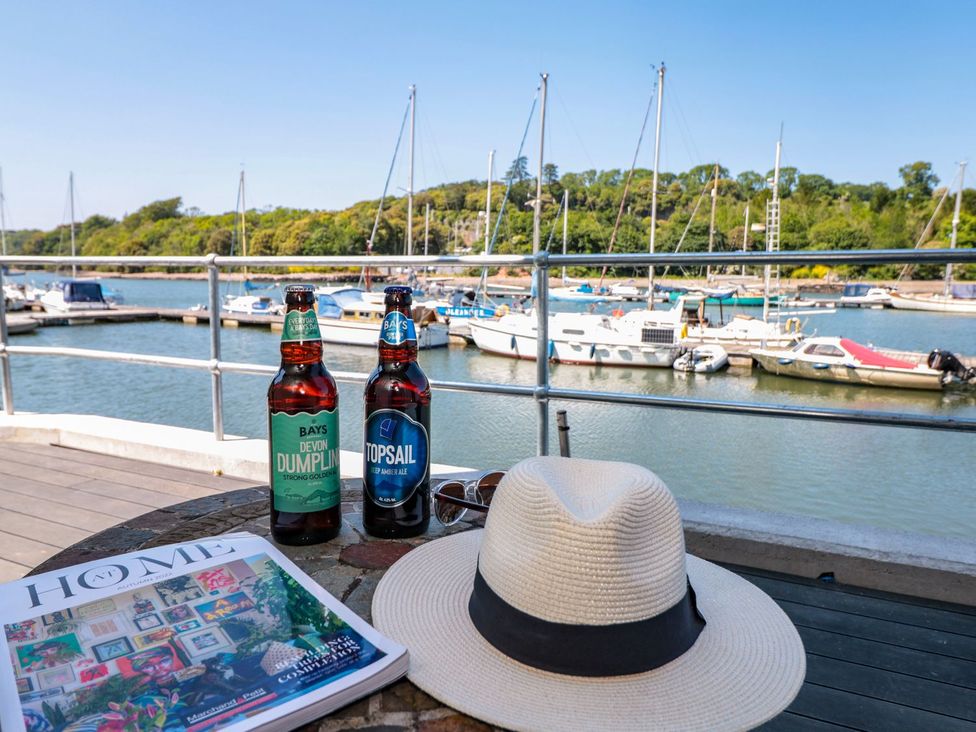 A view of a marina with drinks and a hat at Shipwrights in Brixham