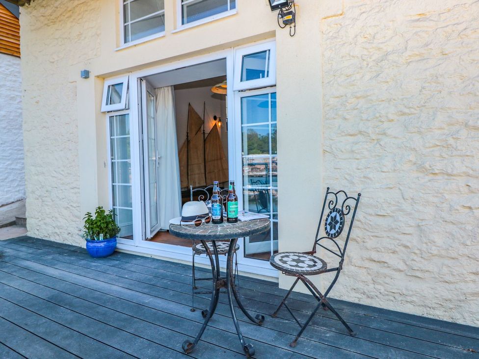 An outdoor space with a table and chairs at Shipwrights in Brixham