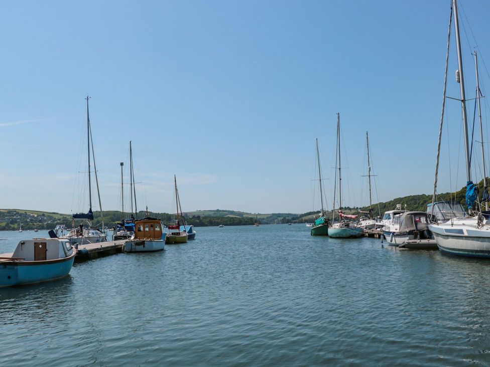 A view of boats at a pier on water at Shipwrights in Brixham