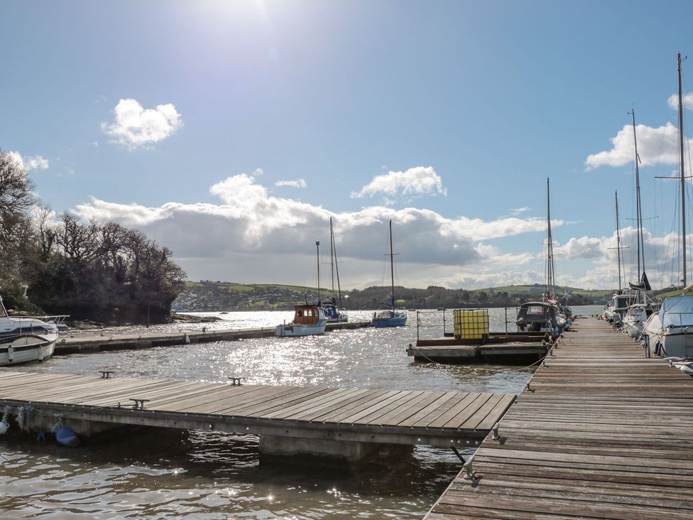 A pier with boats at Spanish Boathouse in Brixham