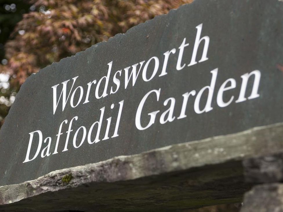 A stone sign displaying Wordsworth Daffodil Garden