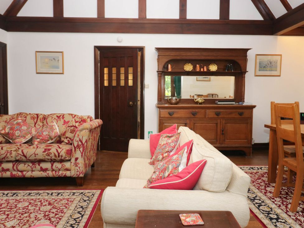 A living room with a sofa and sideboard at White Gables in Grasmere