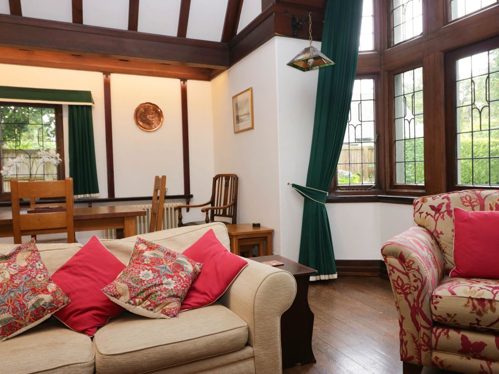 A living room with sofa and chairs at White Gables in Grasmere