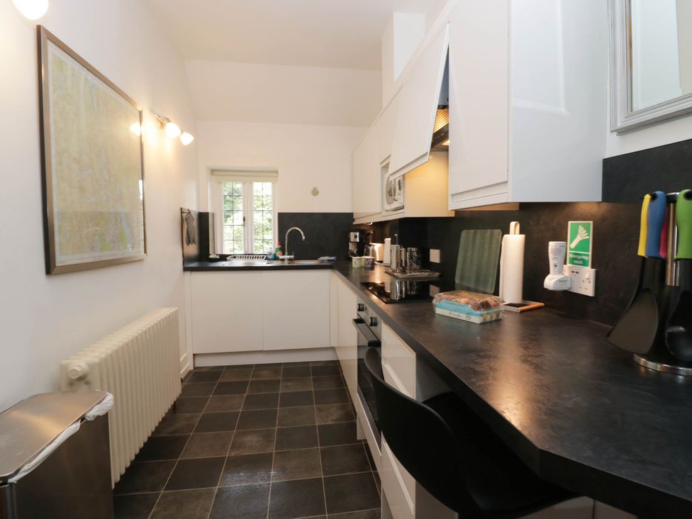 A kitchen with modern appliances and a countertop at White Gables in Grasmere