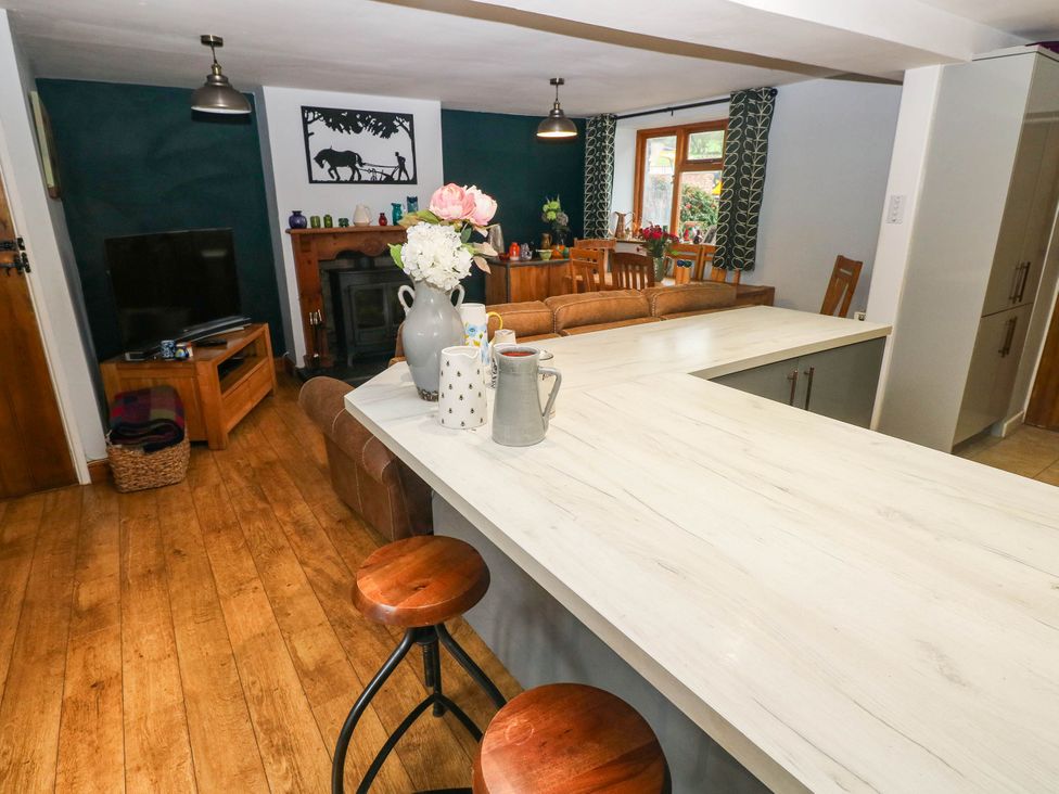 A kitchen with a table and chairs at Greig House Farm Abergavenny