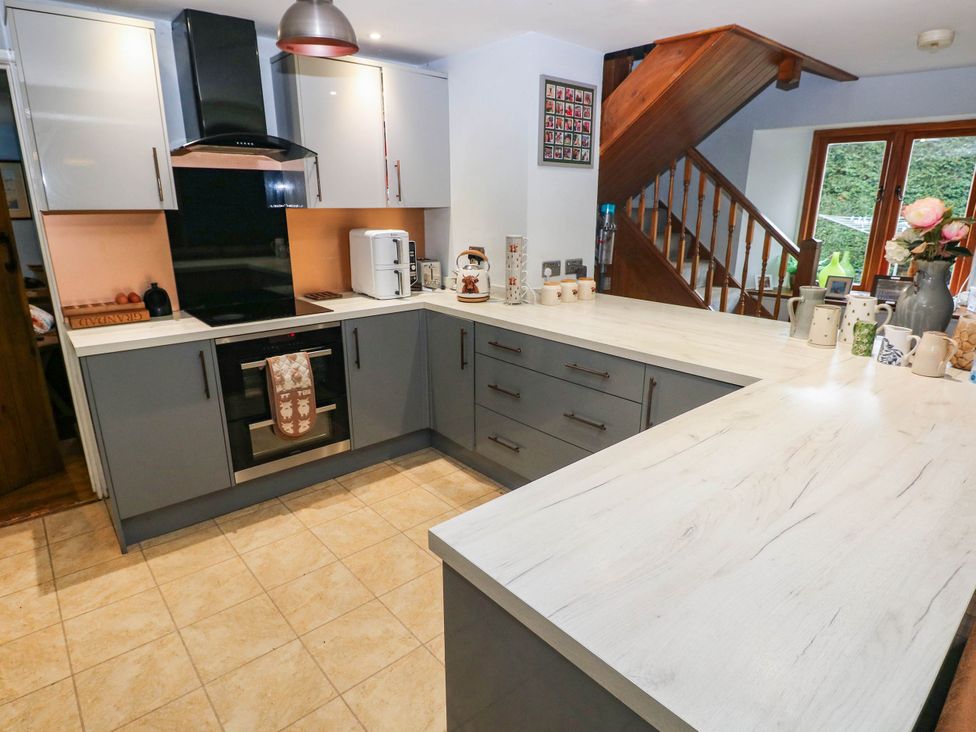 A kitchen with cabinets and a countertop at Greig House Farm Abergavenny