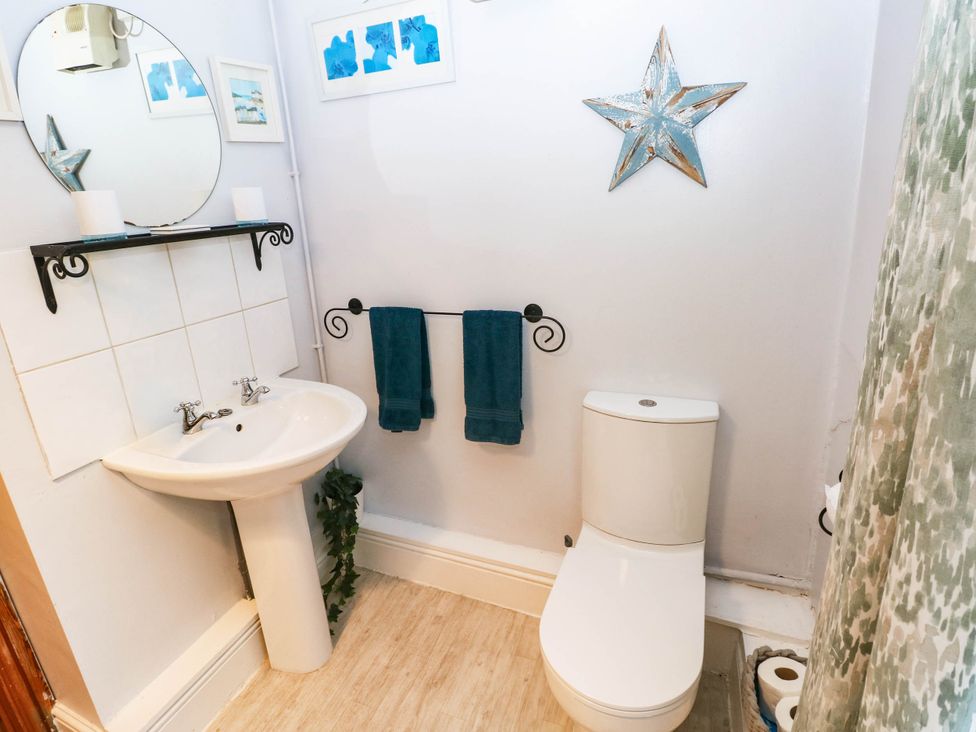 A bathroom with a sink and toilet at Greig House Cottage Abergavenny