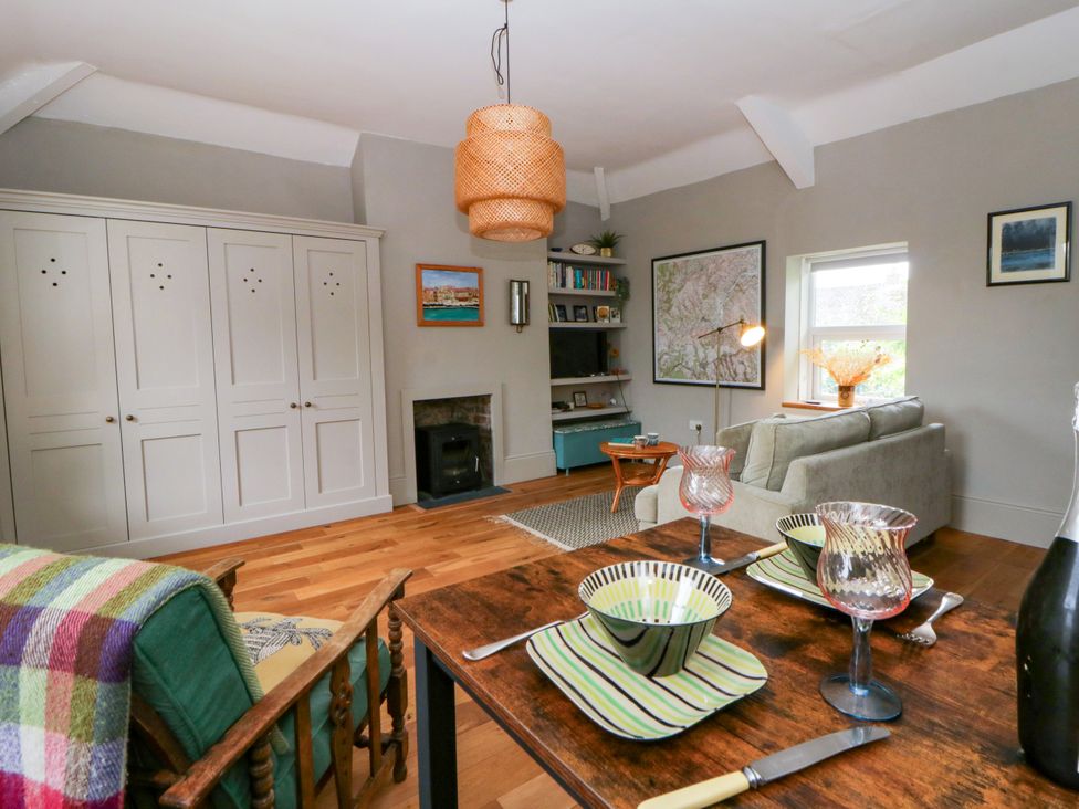 A dining room with a table and chairs at Flat 5 in Hereford