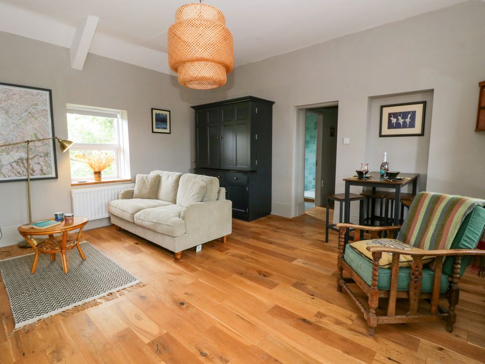 A living room with a sofa and coffee table at Flat 5 in Hereford