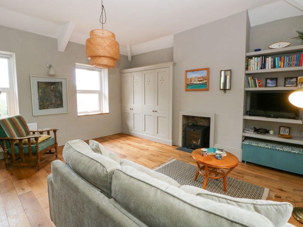 A living room with a sofa and coffee table at Flat 5 in Hereford