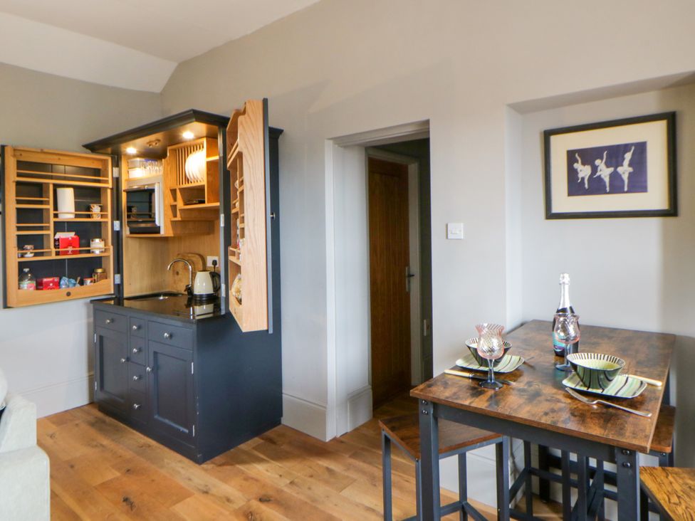 A kitchen with dining area at Flat 5 in Hereford