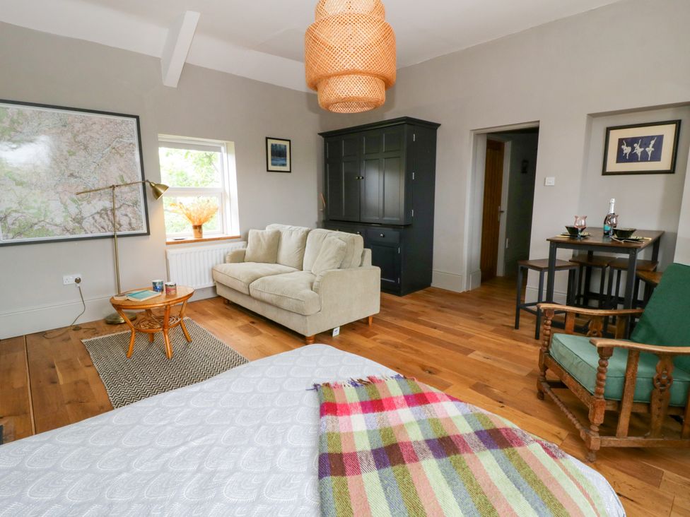 A living room with a map and sofa at Flat 5 Hereford