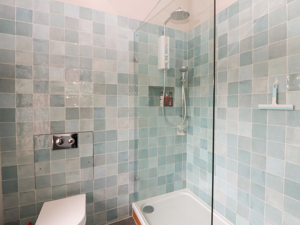 A bathroom with shower and toilet at Flat 5 in Hereford
