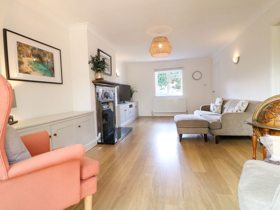 A living room with furniture and a television at 7 Forge Close 