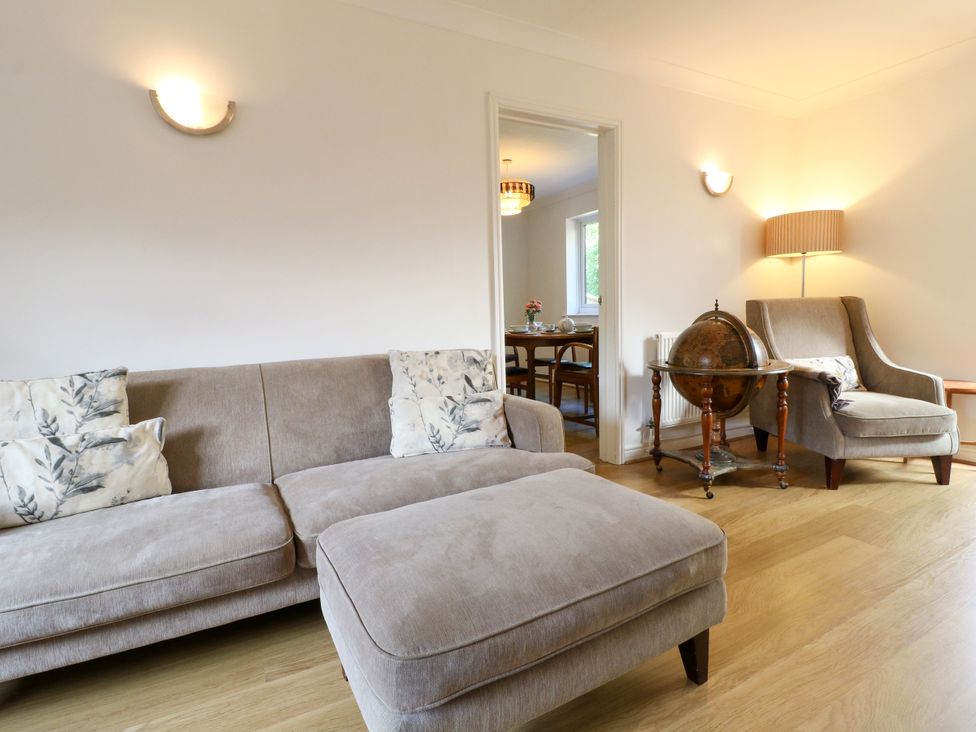 A living room with sofa and armchair at 7 Forge Close
