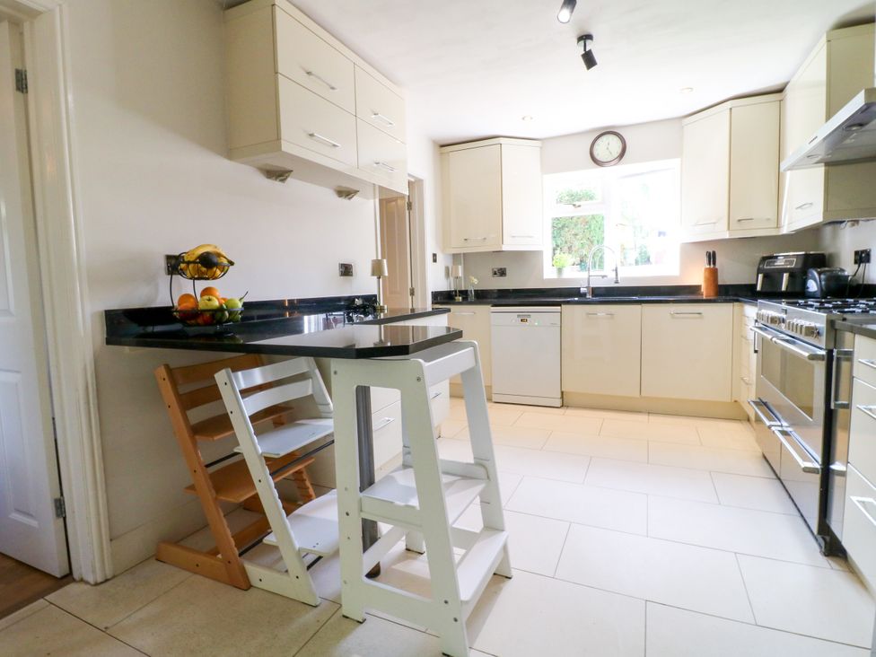 A kitchen with cabinets and countertop at 7 Forge Close