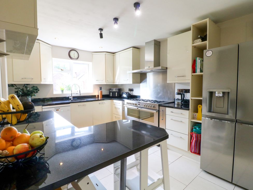A kitchen with a sink and cooking appliances at 7 Forge Close
