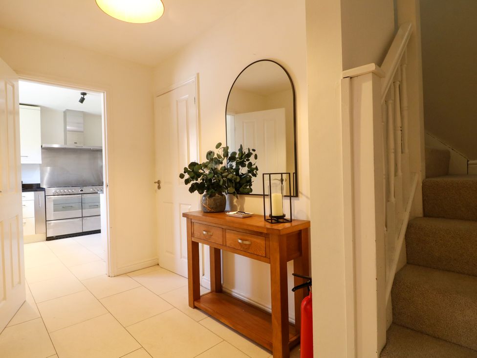 A hallway with a console table and plant at 7 Forge Close