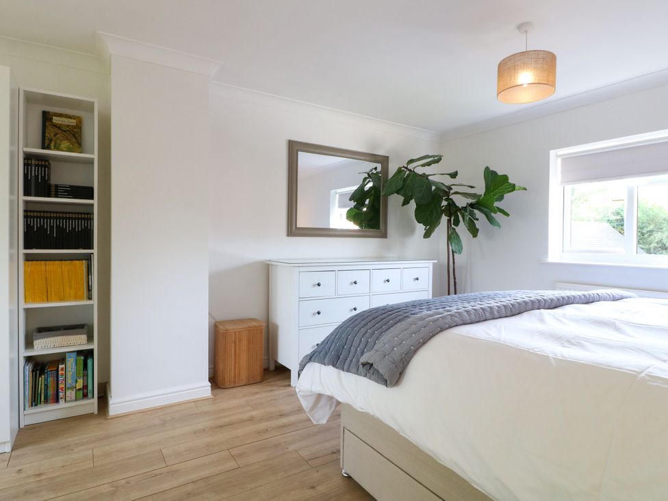 A bedroom featuring a bed, dresser, and bookshelf at 7 Forge Close