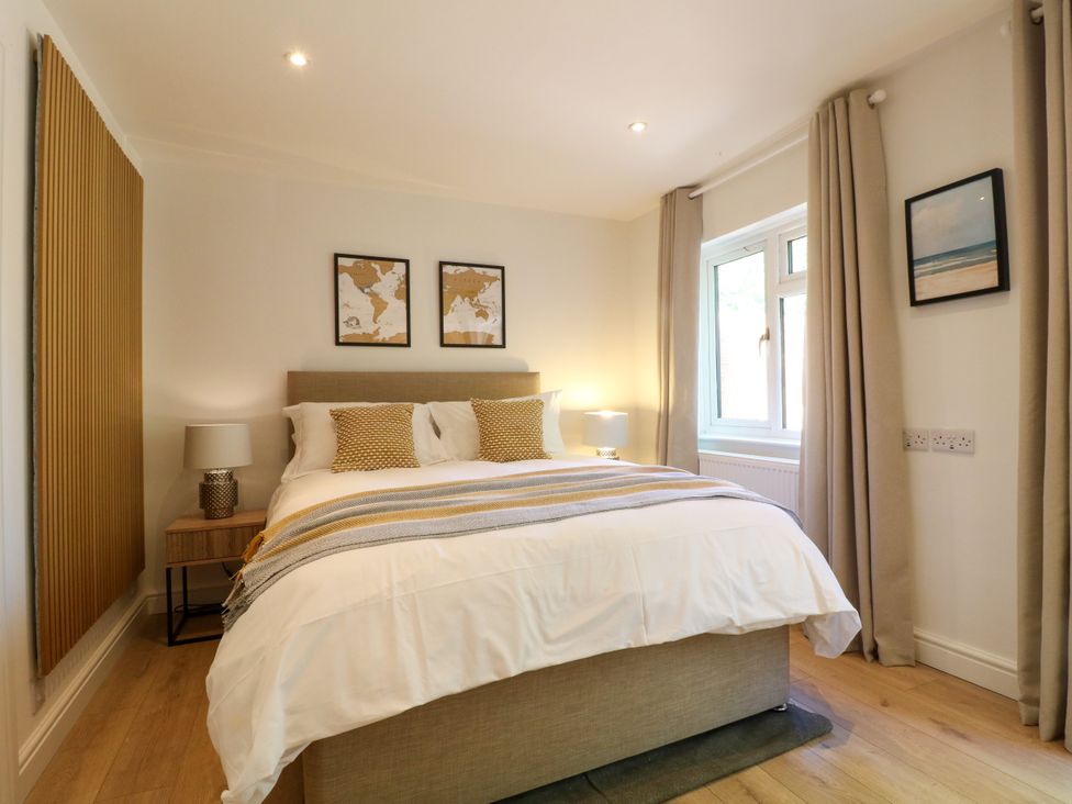 A bedroom with a bed and window at 7 Forge Close 