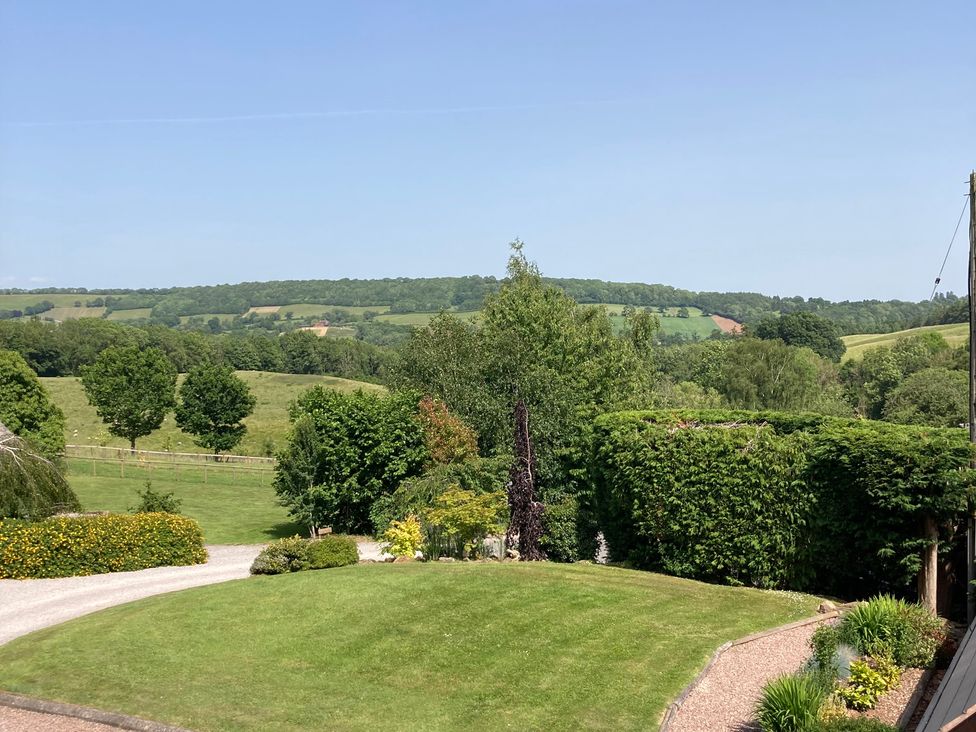 A view of hills and greenery from the garden at Chestnut Lodge in Worcester