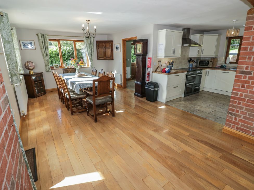 A dining room with a table and chairs at Chestnut Lodge in Worcester