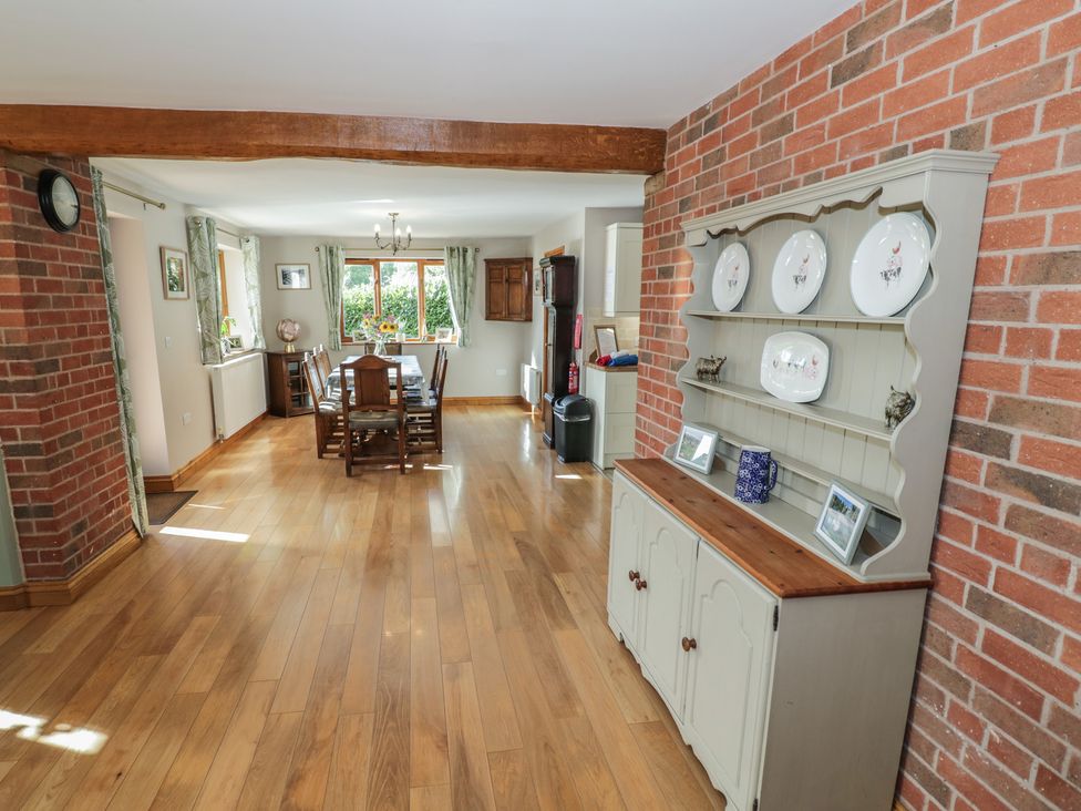 A dining room with a table and chairs at Chestnut Lodge in Worcester