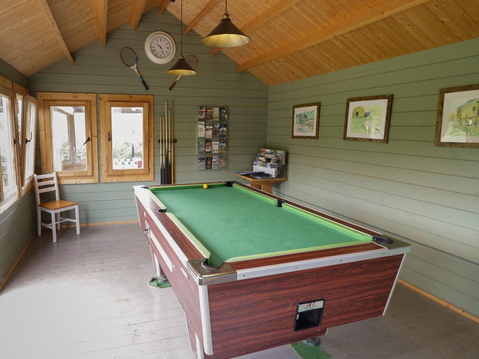 A snug room with a pool table and windows at Chestnut Lodge Worcester
